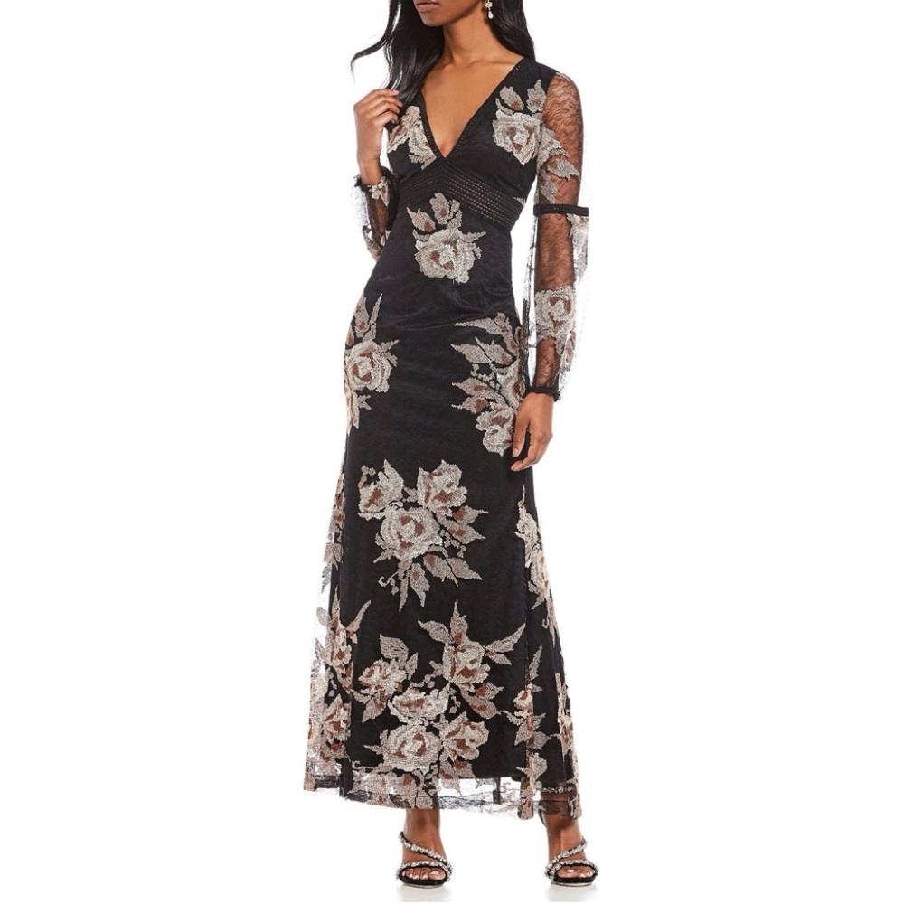 a Belle by Badgley Mischka black floral embroidered mermaid long sleeve gown.